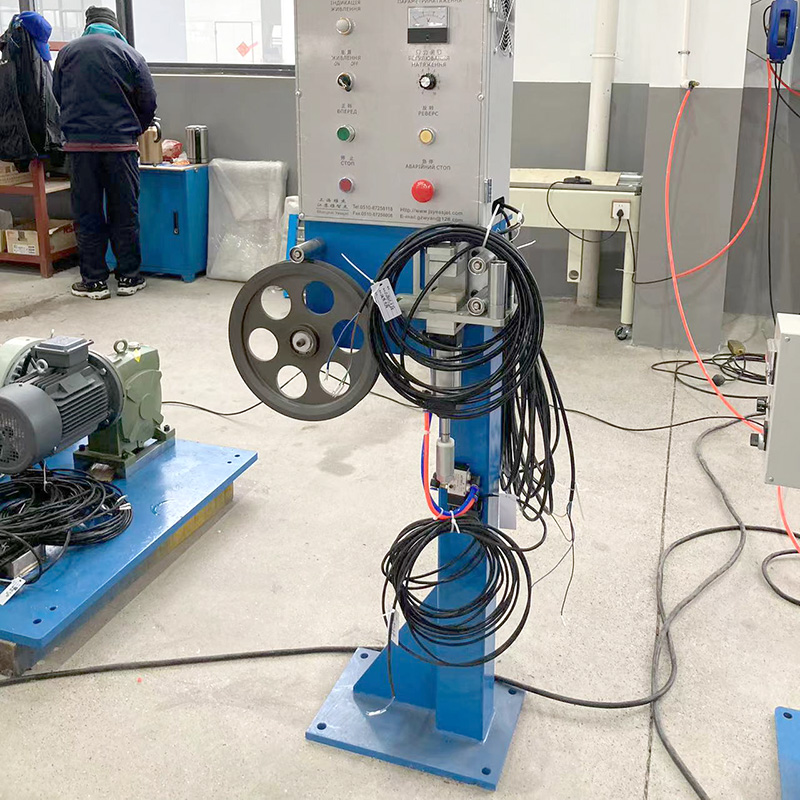 Industrial cable tension control equipment in a manufacturing facility